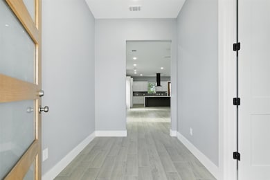 This photo showcases a modern, inviting entryway l