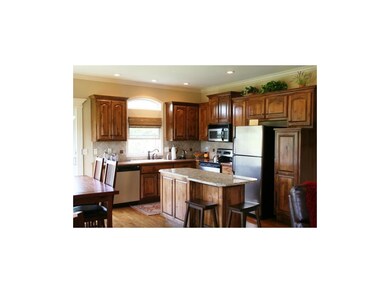 Beautiful kitchen with granite island and stainles