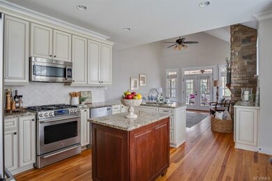 stainless steel appliances, custom backsplash, granite countertops