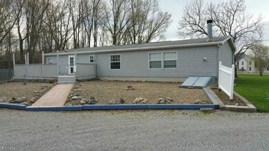 Rear view of house showing 24'x 12' wood deck and 