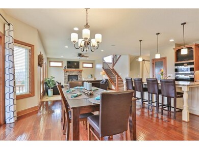 Informal dining overlooks giant deck and private b
