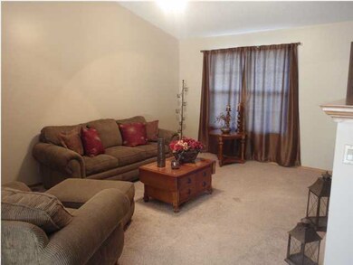 The Living Room features a vaulted ceiling, a gas 