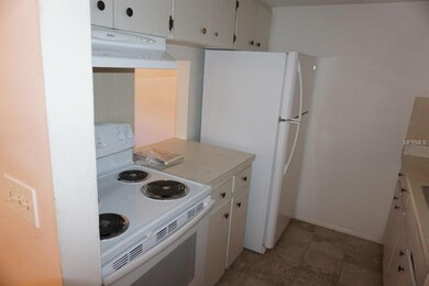 Conveniently spaced appliances in kitchen awaiting