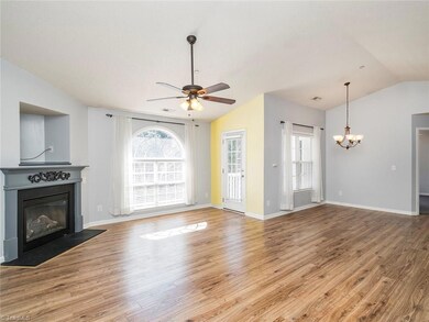 Open concept plan!! The living room offers vaulted ceilings, gas log fireplace and is access to the patio area.
