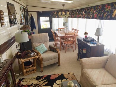 Custom draperies, Berber carpet and a wall of wind