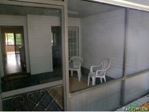 Shady screen porch off kitchen