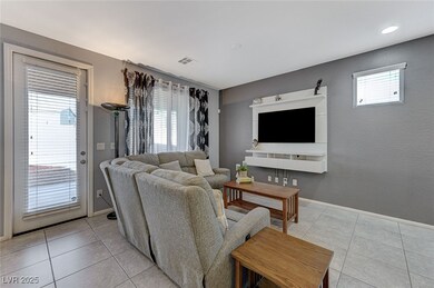 Living room with visible vents, baseboards, and li
