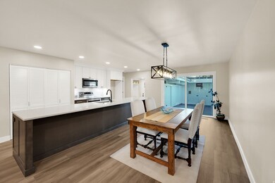 Dining area featuring light wood-style floors and recessed lighting
