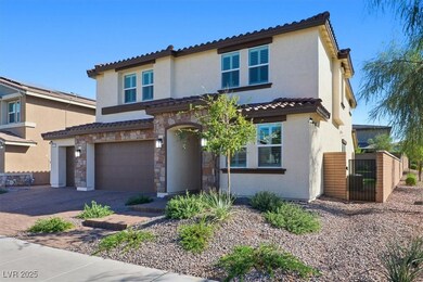 Beautiful front elevation with paver driveway and lush desert landscaping.