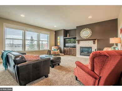 Living room with tile surround gas fireplace, buil
