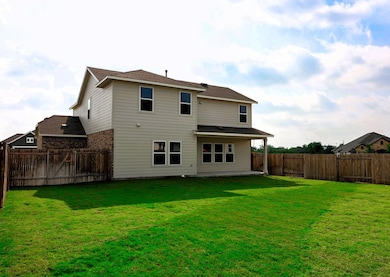 Rear view of property featuring a patio area and 