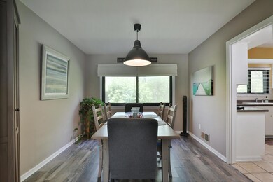 Dining room with new flooring overlookin