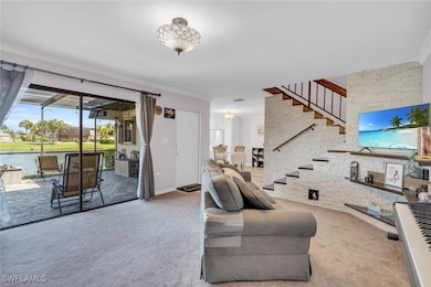 Living room with carpet floors and stairs