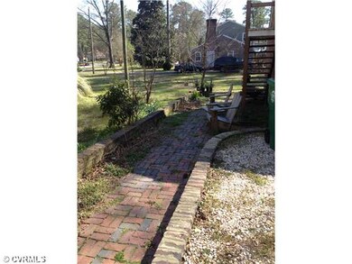 Exterior Back - Brick walk way to the garage and g