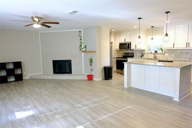 Living room features gas starter fireplace.