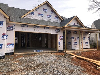 two car garage with country front porch