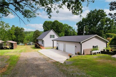 2 car heated and cooled detached garage with single car carport.
