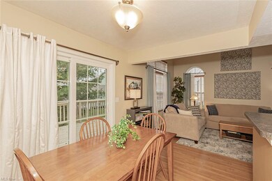 The eat-in kitchen and sliding door to oversized d