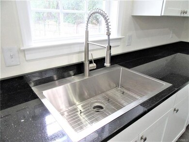 Kitchen's Large Stainless Steel Sink with Upgraded Plumbing Fixtures! Closer Look at the Gorgeous Granite Countertop!