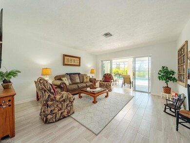 Living area featuring a textured ceiling, baseboar