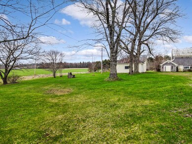 Side yard garage and old ice house