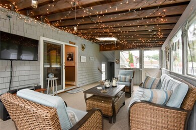 Screened in back porch with view of slider to kitc