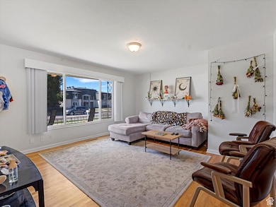 Living room with light wood-style floors and baseboards