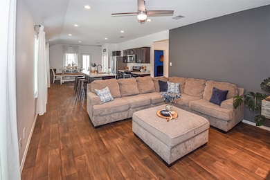 This open-concept living area features a spacious