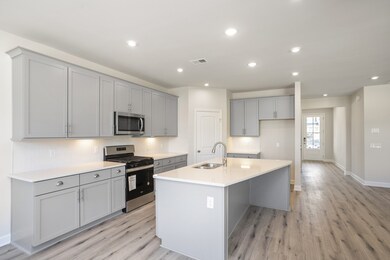 Open Kitchen with large island and offset Dining! Photos of similar home, same plan. Selections vary