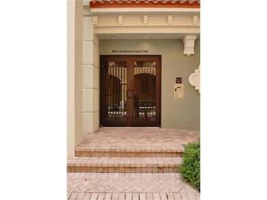 Entry door into building at 8011 Via Monte Carlo W