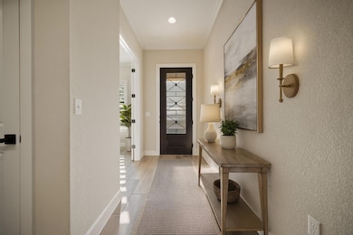 Doorway to outside with a textured wall, crown mo