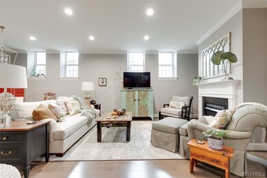 Handsome wood flooring and elegant fixtures throug