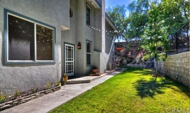 Large Private side yard with bistro lighting.  Gre
