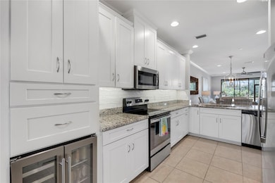 Built-in high-end wine cooler with additional cabinets