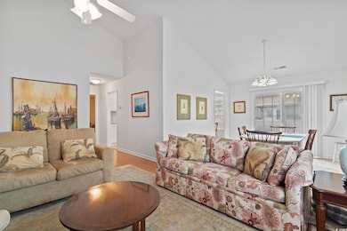 Living area featuring high vaulted ceiling, ceilin