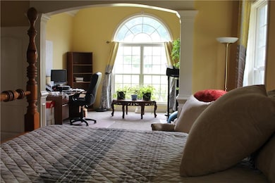 Office featuring arched walkways, carpet, and orna