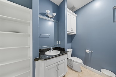 The first-floor suite adds versatility to the home, making it welcoming for visitors and practical for everyday living.