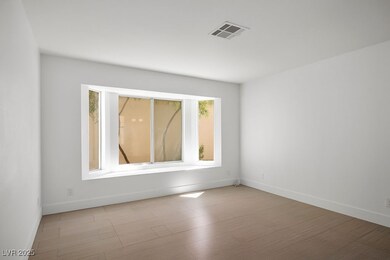 Living room with large bay window.