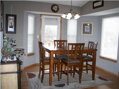 The large dining room has wood floors.