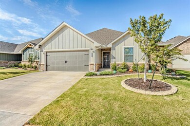 View of front of property featuring a garage and a
