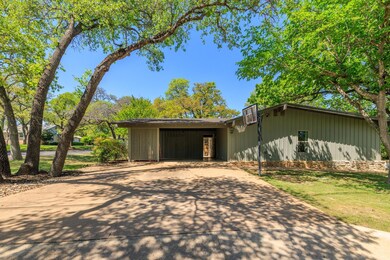 View of front of house featuring concrete drivewa