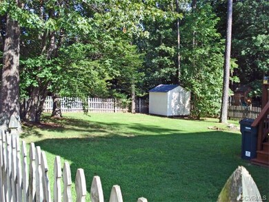 The fenced yard also includes an additional rear w