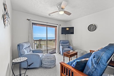 Living area with ocean views and balcony - could be used as bedroom.