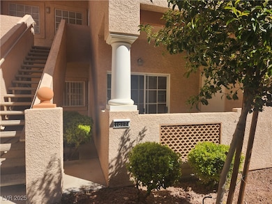 Doorway to property with stucco siding