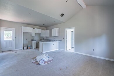 Wonderful Living Room with a vaulted ceiling and o