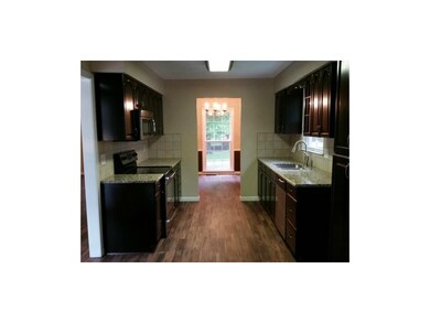Rich espresso finished cabinets with rollouts brin