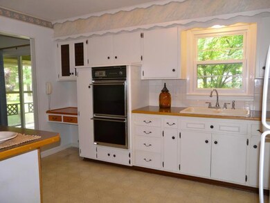 Kitchen with porch exit on left.