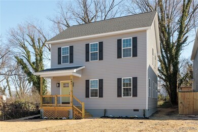 View of front of house with crawl space and a shin