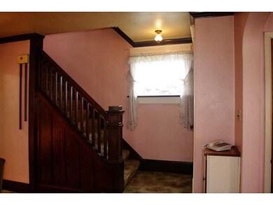 Living Room. Original woodwork and finishes throug