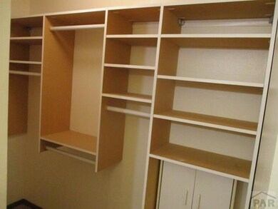 Custom master bed shelving